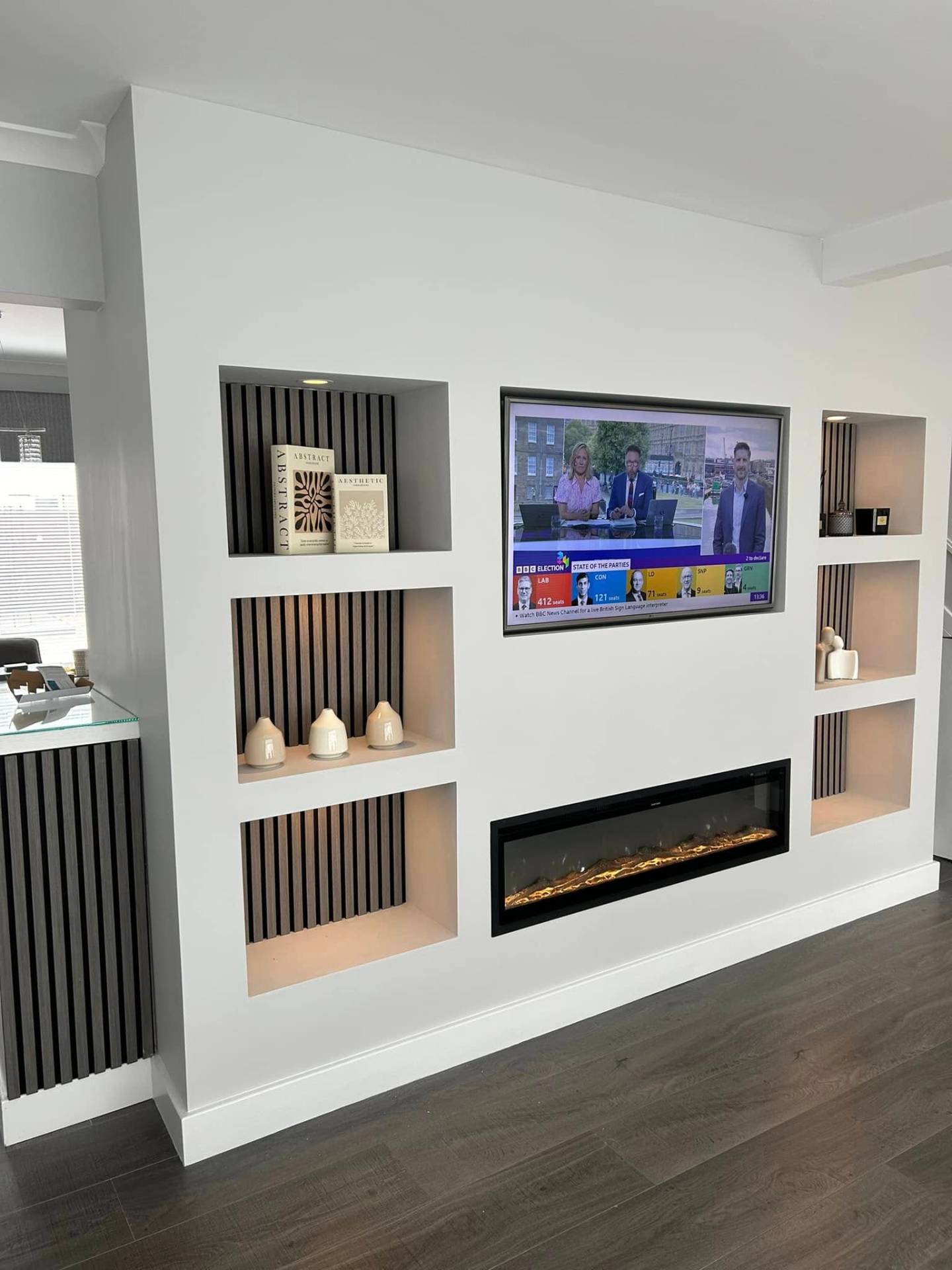 White built-in media wall with electric fire media wall in Bury St Edmunds, Suffolk
